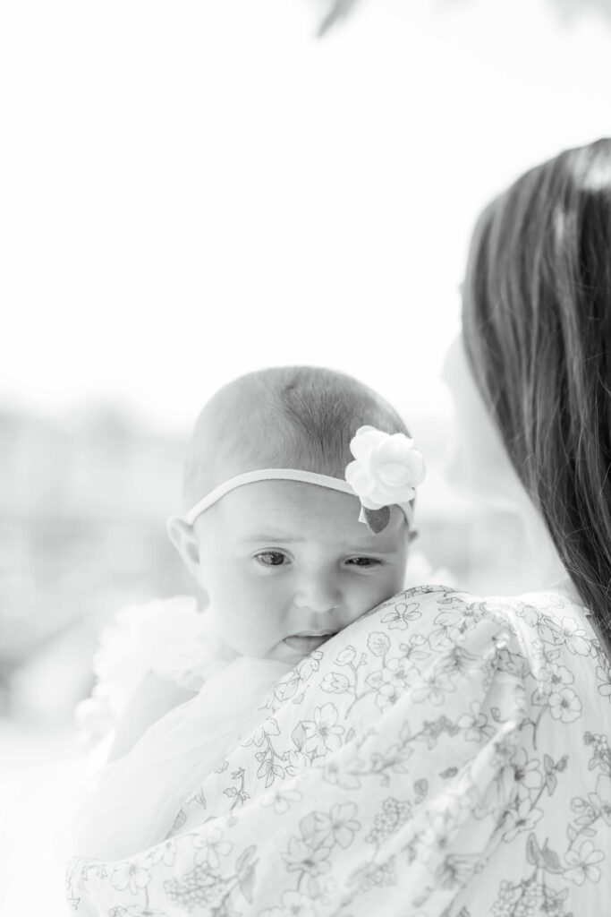 a woman holding a baby