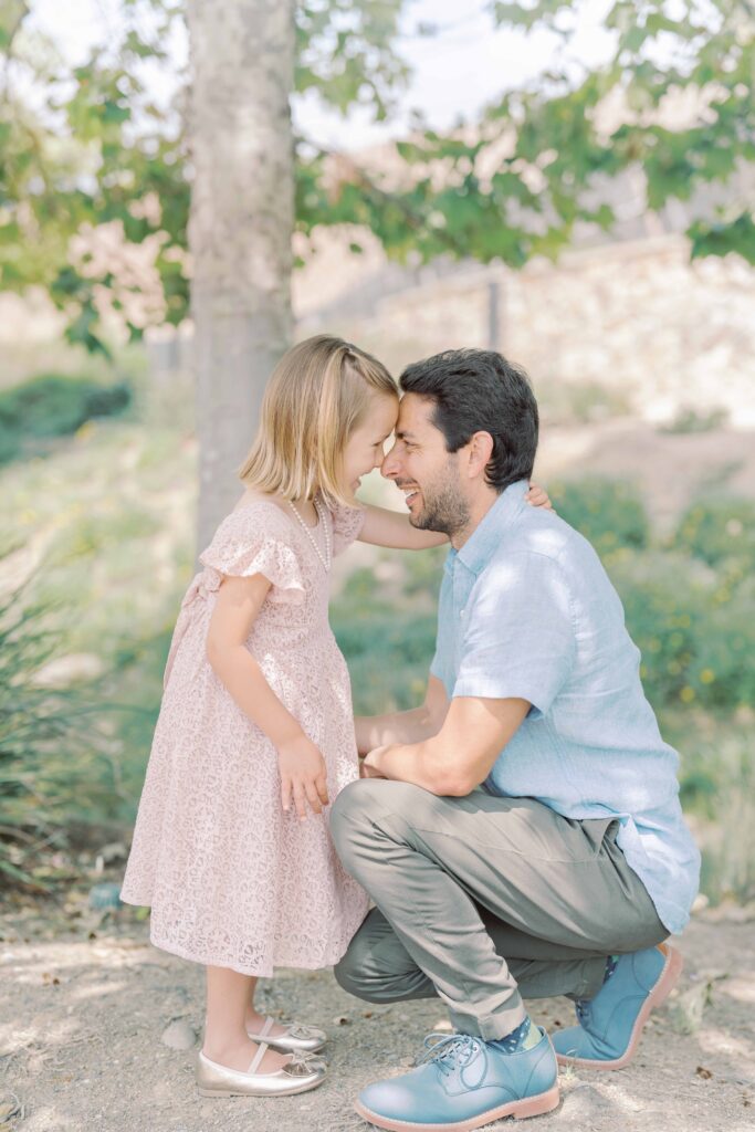 father and daughter posing for a picture at san diego park