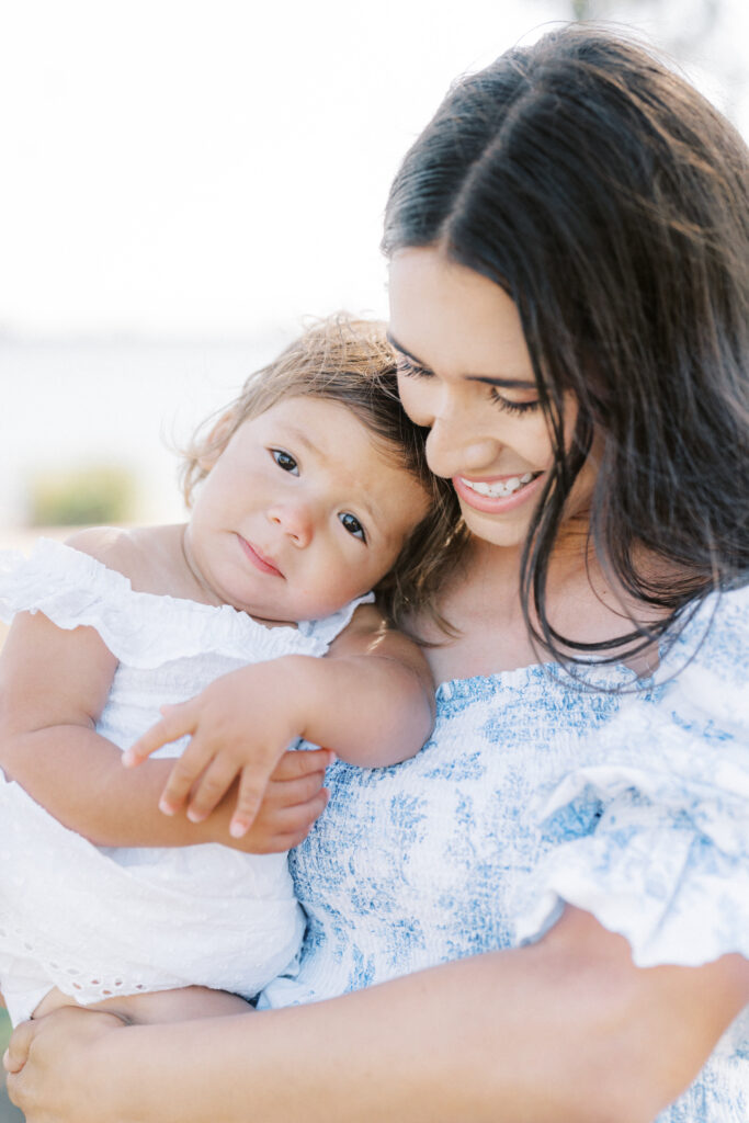 a woman holding a baby