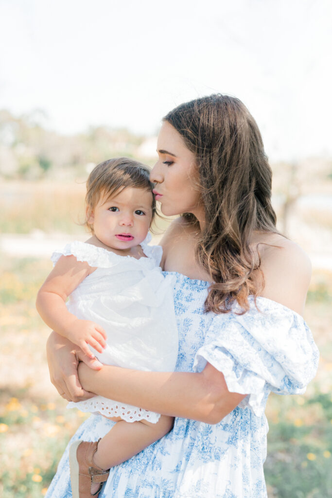 a woman holding a baby