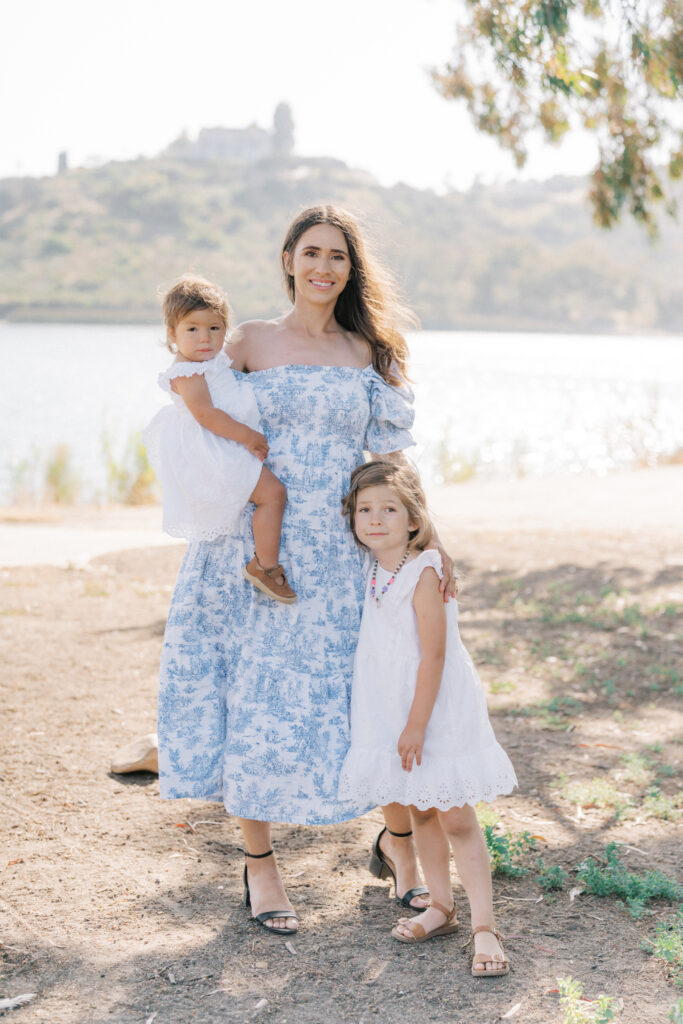 a mother with two girls posing for a picture