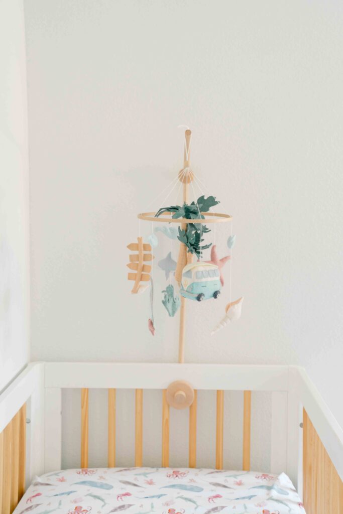 above the crib decor for girl nursery room