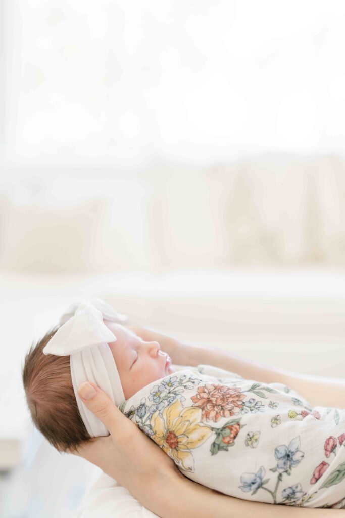 sleeping newborn girl during lifestyle newborn photography in san diego