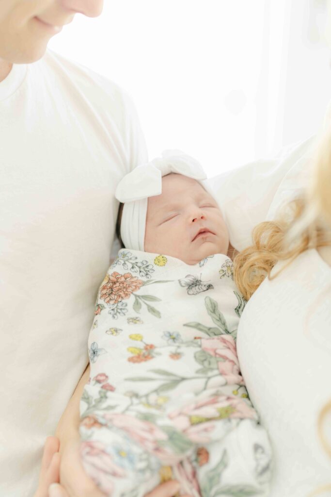 newborn baby girl sleeping during lifestyle newborn photoshoot in san diego