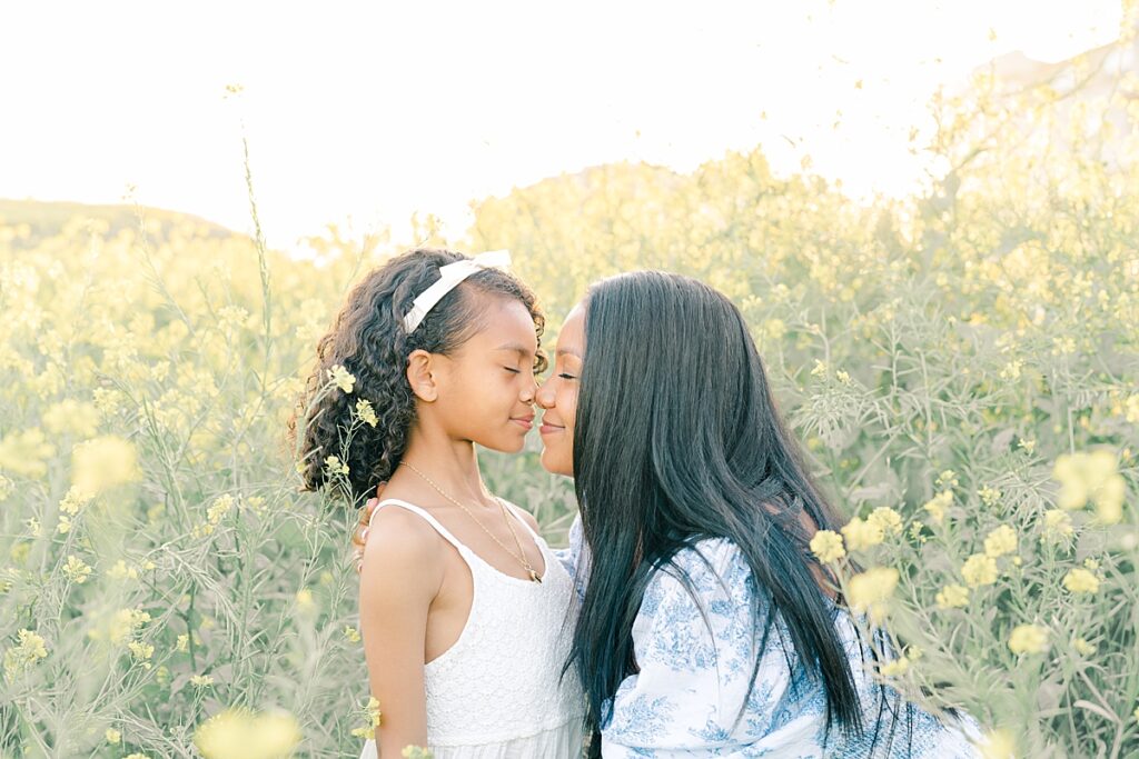 cute mom and daughter pose together