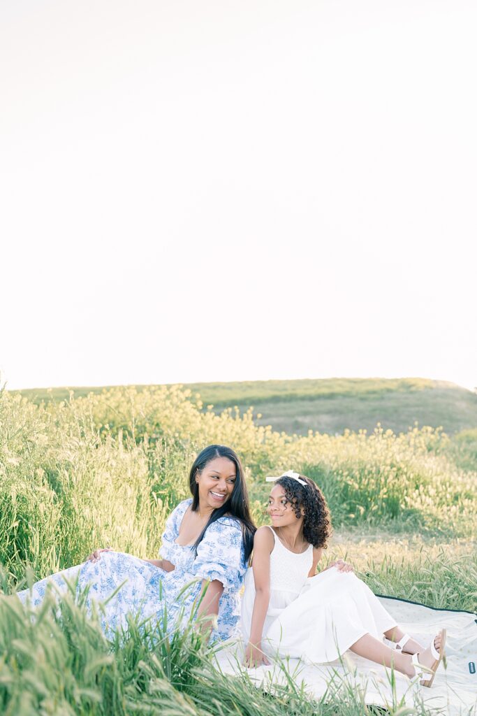 mother daughter poses at outdoor field